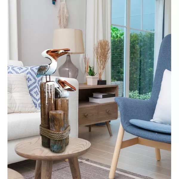 COTA Global Nautical Wooden Pelican Couple Statue  Crafted Pelican Couple Perched on Wood Posts with Beach Style Ropes  Decorative Tabletop Sea Birds Statue Centerpiece  Handmade Color May Vary