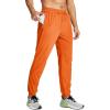 imageMAGCOMSEN Mens Joggers with Zipper Pockets Lightweight Hiking Sweatpants Athletic Pants for Men Running Workout Traning GymOrange