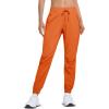 imageMAGCOMSEN Womens Hiking Pants Lightweight Quick Dry Athletic Running Joggers with Pockets Outdoor Travel SweatpantsOrange