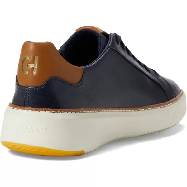 Cole Haan Womens Grandpro Topspin SneakerNavy Blazer LeatherBritish TanIvory