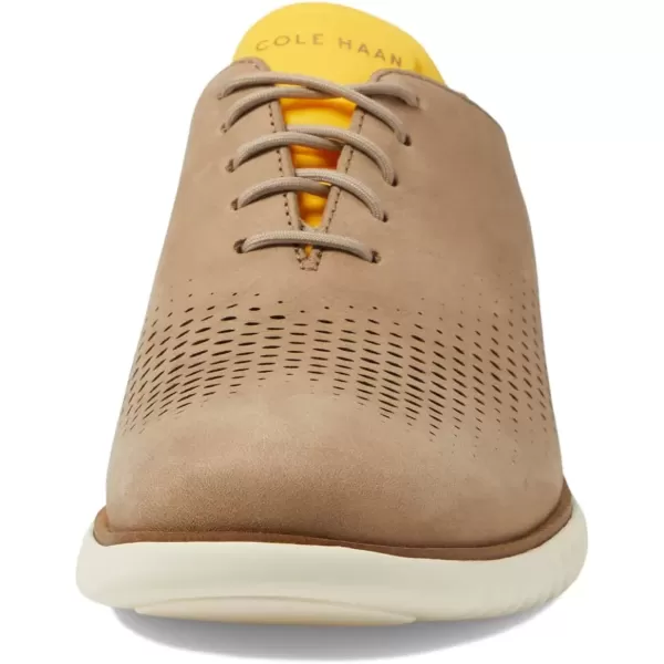 imageCole Haan Mens 2Zerogrand Laser Wingtip OxfordDune NubuckGold FusionIvory