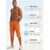 imageTACVASEN Mens Quick Dry Hiking 34 Long Capri Shorts Athletic Workout Running Shorts with Zipper PocketsOrange